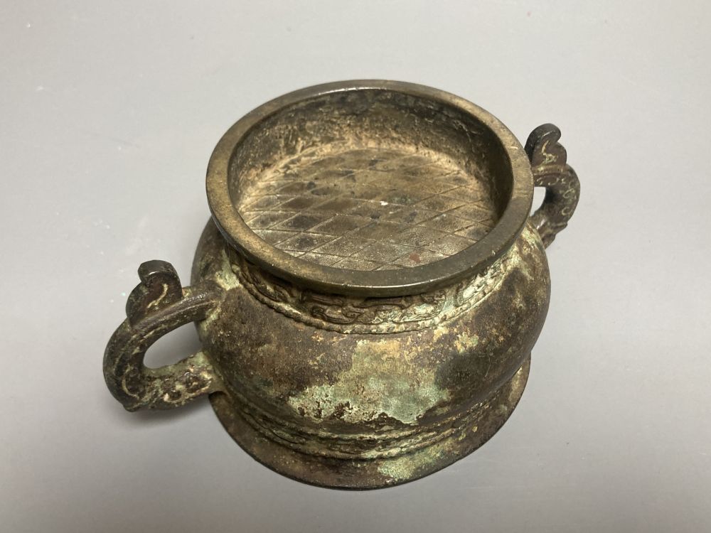 An 18th century Chinese archaistic bronze two handled censer, 16.5cm handle to handle